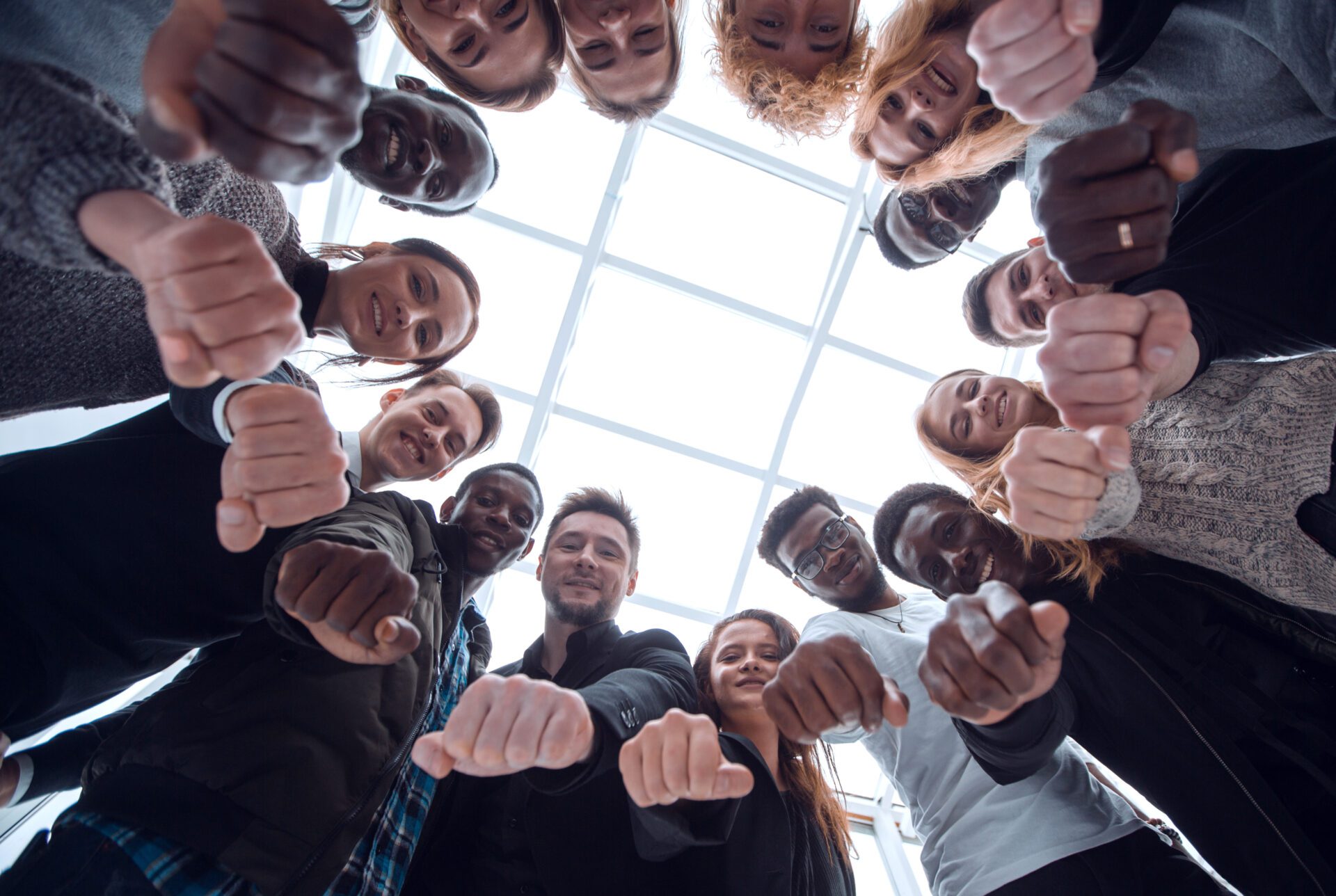 group of diverse ambitious young people standing in a circle bottom view . group of diverse ambitious young people standing in a circle
